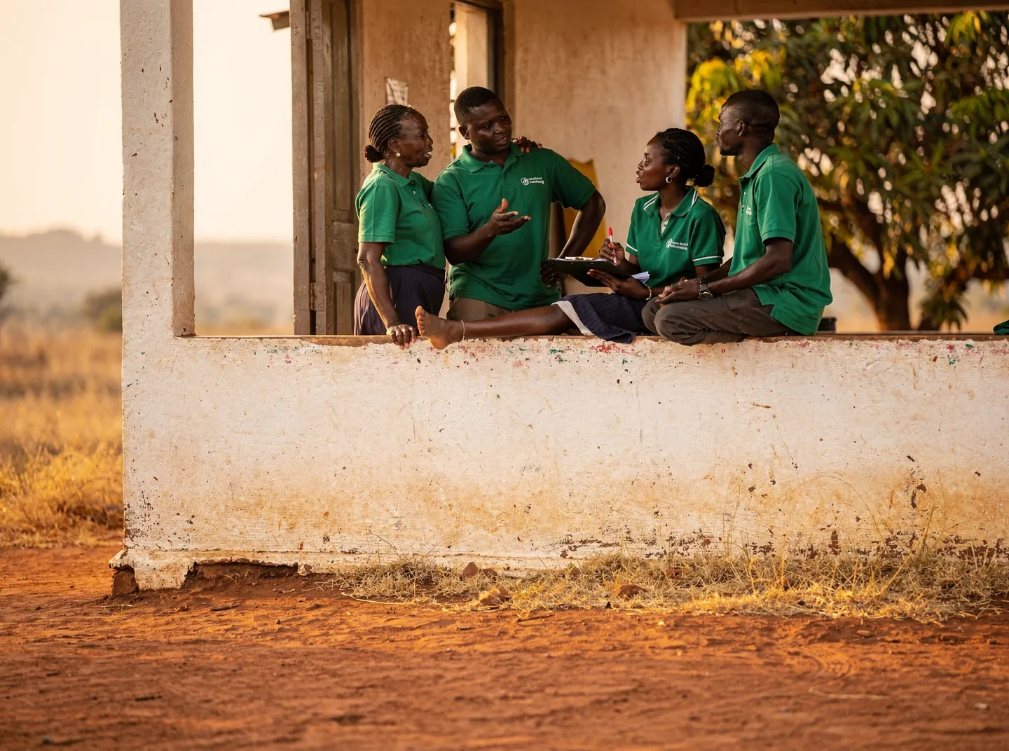 A community health team comparing notes at a rural health post
